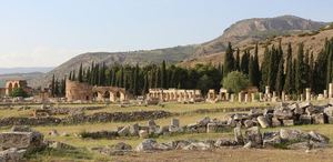 The colonnaded Frontinus Street and Domitian Gate of ancient Hierapolis, on the hill above Pamukkale