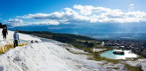 The white travertine terraces of Pamukkale falling away toward the plain, below Hierapolis