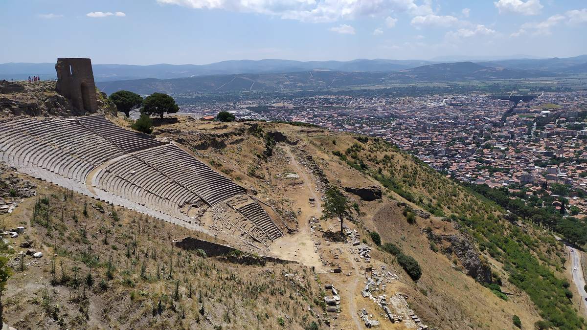The theater of Pergamon cut into the steep slope of the acropolis, with Bergama spread out below