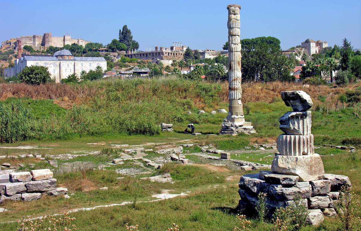 Three faiths on one skyline at Selçuk: the lone column of the Temple of Artemis, the fourteenth-century İsa Bey Mosque, and the Basilica of St. John on the hill below the Ayasuluk fortress