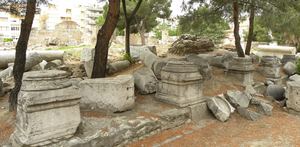 Roman column pedestals and fallen shafts under the pines at the Thyatira ruins in Akhisar