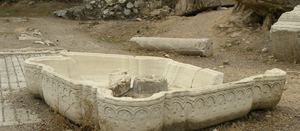 A carved marble fountain basin lying among the ruins of Thyatira at Akhisar